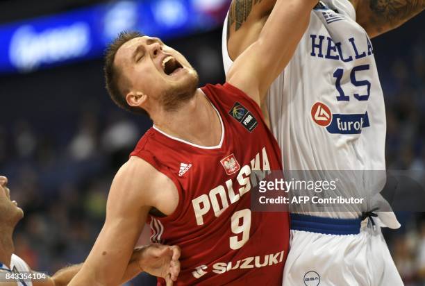 Mateusz Ponitka of Poland and Georgios Printezis of Greece vie during the basketball European Championships Eurobasket 2017 qualification round match...
