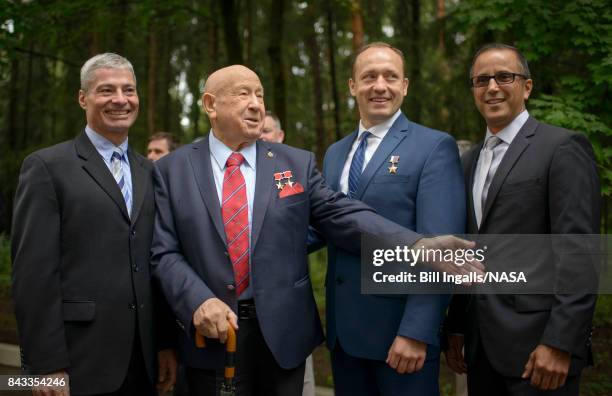 In this handout photo provided by NASA, Russian Cosmonaut Alexei Leonov, the first human to walk in space, second from left, meets with Expedition 53...