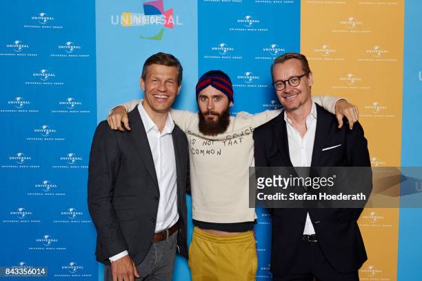 Frank Briegmann, Jared Leto and Dirk Baur pose for a photo during Universal Inside 2017 organized by Universal Music Group at Mercedes-Benz Arena on...
