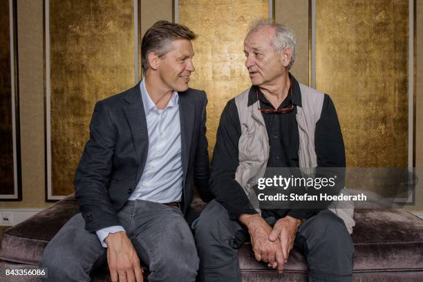 Frank Briegmann and Bill Murray pose for a photo during Universal Inside 2017 organized by Universal Music Group at Mercedes-Benz Arena on September...