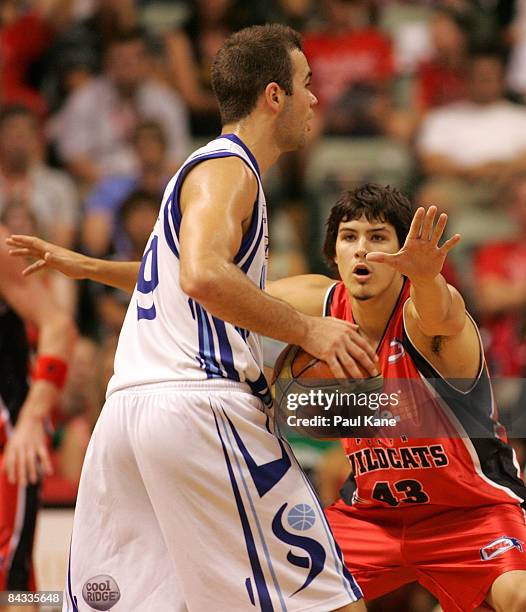 Chris Goulding of the Wildcats holds out Drew Williamson of the Spirit during the round 18 NBL match between the Perth Wildcats and the Sydney Spirit...