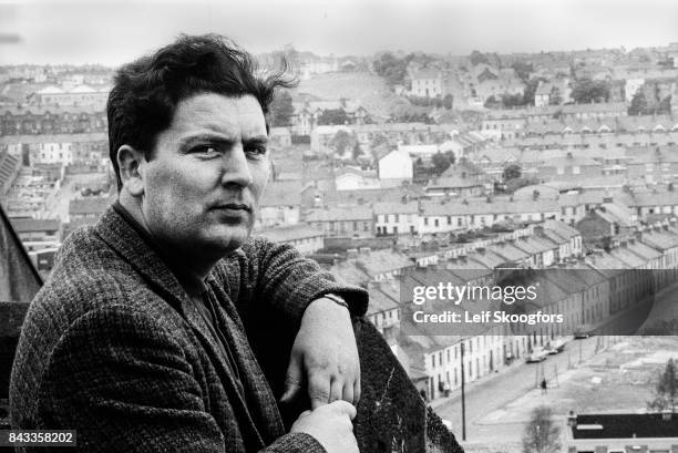 Portrait of Irish politician John Hume as he poses on a rooftop that overlooks the Catholic Bogside neighborhood, Londonderry , Northern Ireland,...