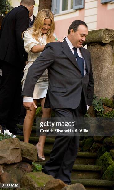 Actress Kate Hudson holds up to a security man after "Bride Wars" photocall at De Russie Hotel on January 17, 2009 in Rome, Italy.
