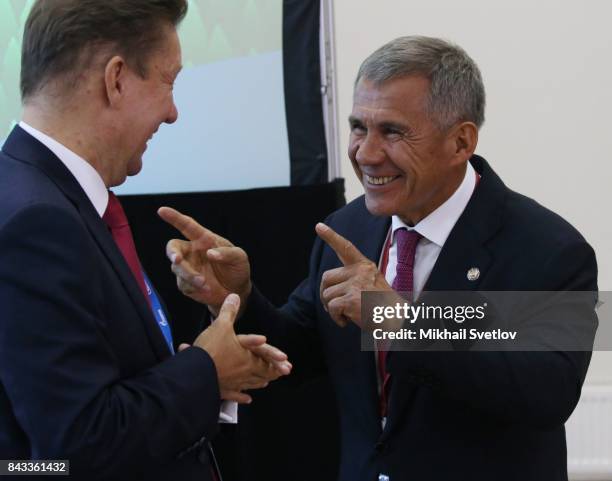 Tatarstan Republic President Rustam Minnikhanov talks to Gazprom's CEO Alexei Miller during the State Council meeting at the Eastern Economic Fourm...