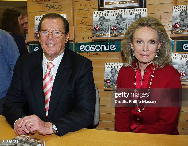 Roger Moore signs copies of his book 'My Word Is My Bond' with his wife Christina Tholstrup in Easons on January 17, 2009 in Dublin, Ireland