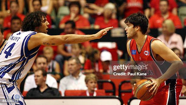 Matthew Knight of the Spirit holds out Stephen Weigh of the Wildcats during the round 18 NBL match between the Perth Wildcats and the Sydney Spirit...