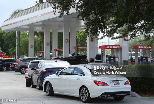 Vehicles are lined up at a gas station in hopes of getting gas to prepare for Hurricane Irma on September 6, 2017 in Doral, Florida. It's still too...