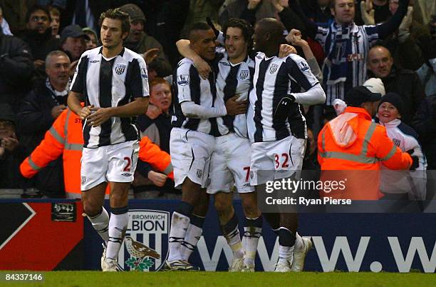 Robert Koren of West Bromwich Albion celebrates with teammates after he scored his team's third goal during the Barclays Premier League match between...