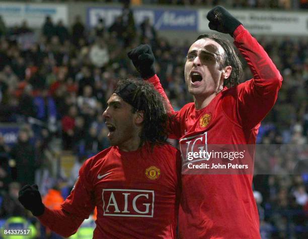 Dimitar Berbatov of Manchester United celebrates scoring their first goal during the Barclays Premier League match between Bolton Wanderers and...