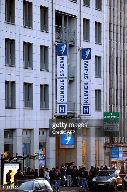 People are pictured on January 17, 2009 in front of Brussels' Sint-Jan / Saint-Jean hospital where Belgium's Queen Fabiola was hospitalized yesterday...