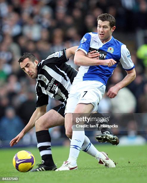 Jose Enrique tangles with Brett Emerton during the Barclays Premier League match between Blackburn Rovers and Newcastle United at Ewood Park on...