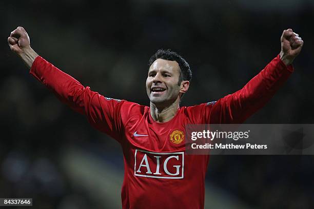 Ryan Giggs of Manchester United celebrates Dimitar Berbatov scoring their first goal during the Barclays Premier League match between Bolton...