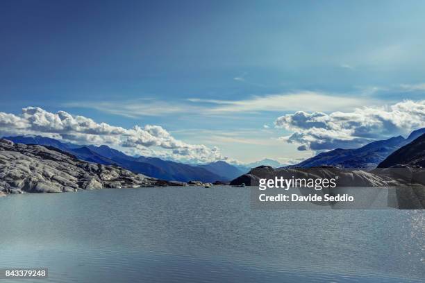 pond of the melting rhone glacier - rhone stock-fotos und bilder