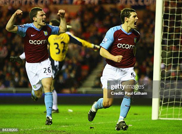 Gareth Barry of Aston Villa celebrates with Craig Gardner after scoring the second goal for Aston Villa during the Barclays Premier League match...