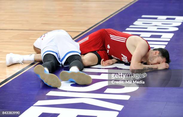 Thanasis Antetokounmpo of Greece, Aaron Cel of Poland lie on the floor injured during the FIBA Eurobasket 2017 Group A match between Greece and...