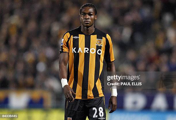 Hull City's new signing, Angolan forward Manucho shows an eye injury during their English Premier League football match against Arsenal on January...