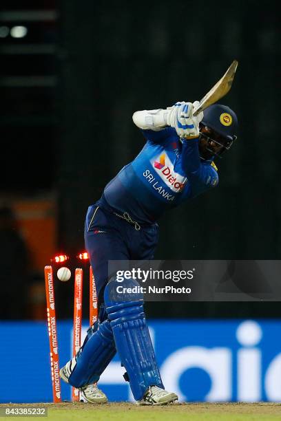 Sri Lankan cricketer Upul Tharanga is bowled out during the 1st and only T-20 cricket match between Sri Lanka and India at R Premadasa International...