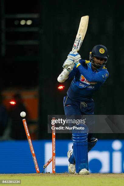 Sri Lankan cricketer Upul Tharanga is bowled out during the 1st and only T-20 cricket match between Sri Lanka and India at R Premadasa International...