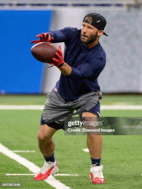 Wide receiver Julian Edelman of the New England Patriots catches a pass as he warms up on the field prior to a preseason game on August 25, 2017...