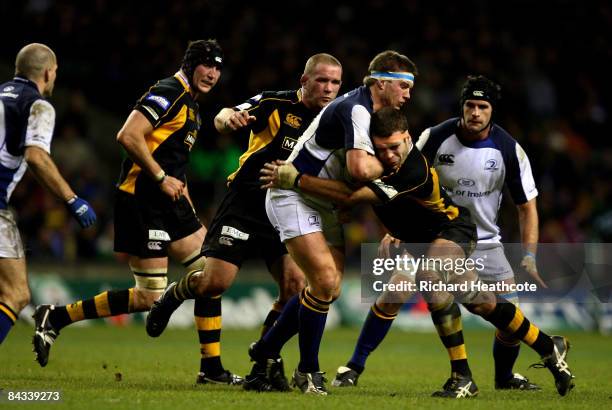 Sean O'Brien of Leinster is tackled by Joe Worlsey of Wasps during the Heineken Cup match between London Wasps and Leinster Rugby at Twickenham on...