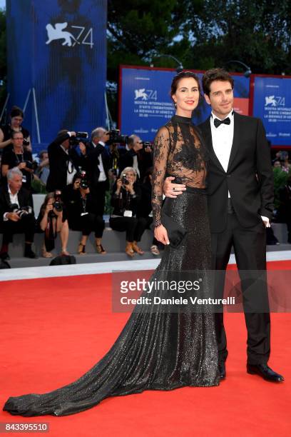 Gloria Bellicchi and Giampaolo Morelli walk the red carpet ahead of the 'Ammore E Malavita' screening during the 74th Venice Film Festival at Sala...