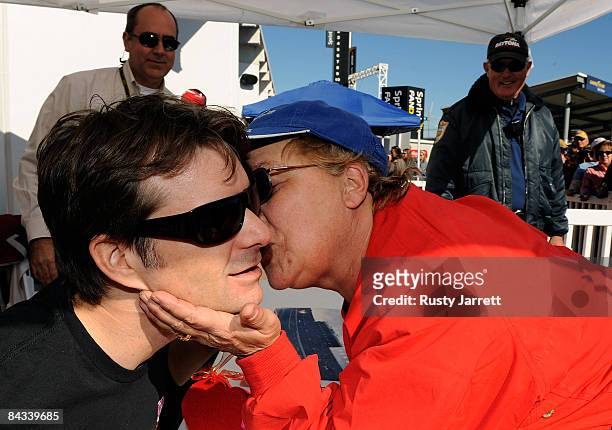 Fan asked to wisper in his ear and suprised Jeff Gordon, driver of the Dupont Chevrolet with a kiss during NASCAR Preseason Thunder at Daytona...
