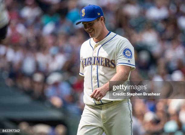 Starting pitcher Andrew Albers of the Seattle Mariners smiles as he walks off the field during a game against the Oakland Athletics at Safeco Field...