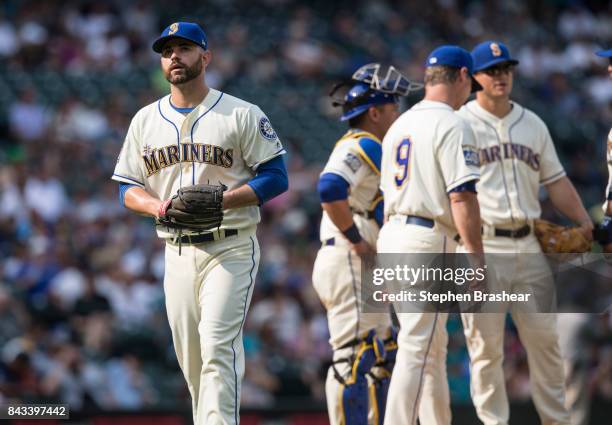 Relief pitcher Marc Rzepczynski of the Seattle Mariners walks off the field after being pulled from a game against the Oakland Athletics at Safeco...