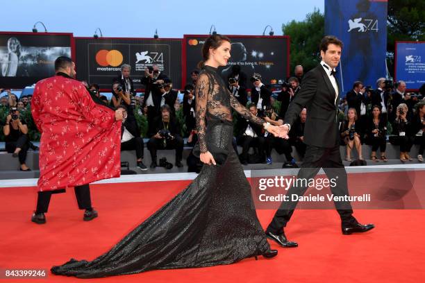 Gloria Bellicchi and Giampaolo Morelli walk the red carpet ahead of the 'Ammore E Malavita' screening during the 74th Venice Film Festival at Sala...