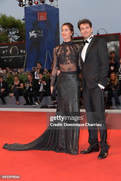 Gloria Bellicchi and Giampaolo Morelli walk the red carpet ahead of the 'Ammore E Malavita' screening during the 74th Venice Film Festival at Sala...