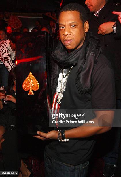 Jay-Z poses with "Ace of spades" Magnum at his American History Inaugural Gala at Club Love on January 16, 2009 in Washington, DC.