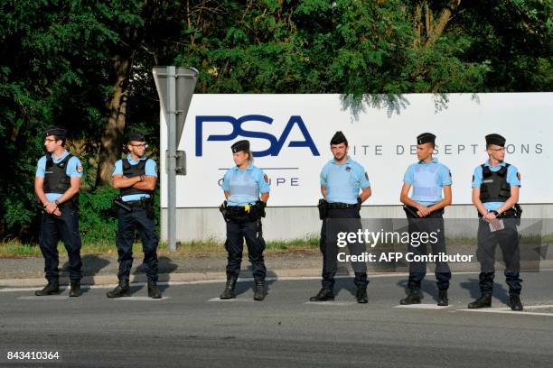 French gendarmes block the entrance of the foundry of Sept-Fons, a site of PSA, in Dompierre-sur-Besbre, to employees from GM&S auto parts...