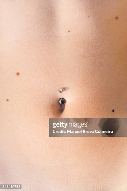 belly button - body piercings stock pictures, royalty-free photos & images