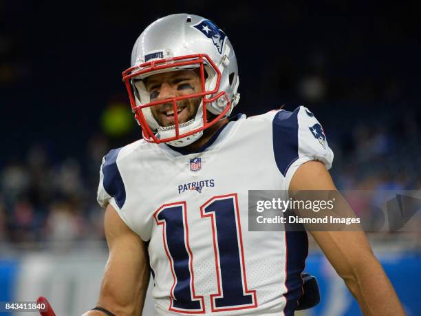 Wide receiver Julian Edelman of the New England Patriots smiles as he walks toward the sideline prior to a preseason game on August 25, 2017 against...