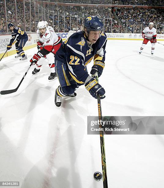 Adam Mair of the Buffalo Sabres skates away from Tim Gleason of the Carolina Hurricanes on January 17, 2009 at HSBC Arena in Buffalo, New York.