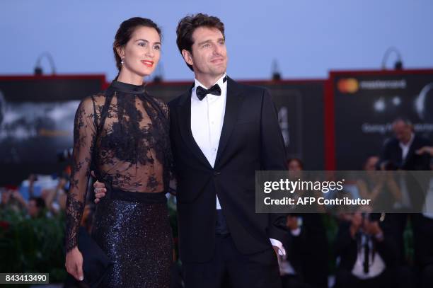 Actor Giampaolo Morelli and partner Gloria Bellicchi attend the premiere of the movie "Ammore E Malavita" presented in competition at the 74th Venice...