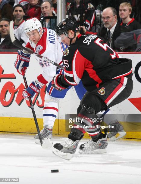 Christoph Schubert of the Ottawa Senators defends against a backhand pass by Andrei Kostitsyn of the Montreal Canadiens at Scotiabank Place on...