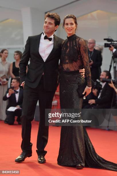 Actor Giampaolo Morelli and parner Gloria Bellicchi attend the premiere of the movie "Ammore E Malavita" presented in competition at the 74th Venice...