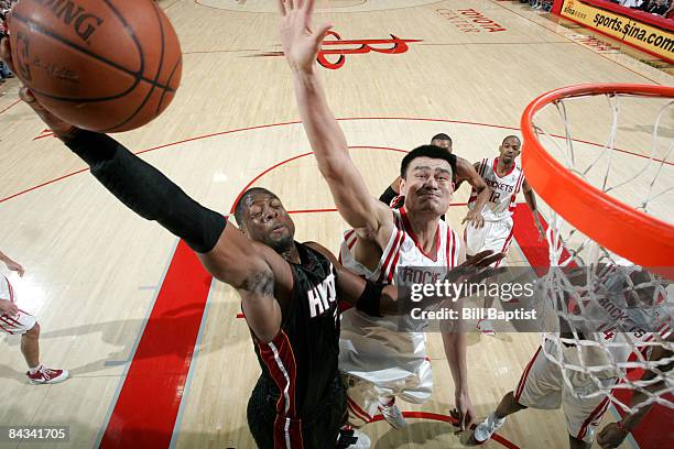 Dwyane Wade of the Miami Heat shoots the ball over Yao Ming of the Houston Rockets on January 17, 2009 at the Toyota Center in Houston, Texas. NOTE...