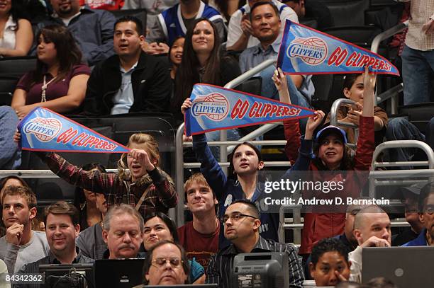 Fans hold up signs during a game between the Milwaukee Bucks and the Los Angeles Clippers at Staples Center on January 17, 2009 in Los Angeles,...