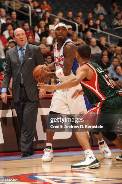 Ricky Davis of the Los Angeles Clippers holds the ball against Charlie Bell of the Milwaukee Bucks at Staples Center on January 17, 2009 in Los...