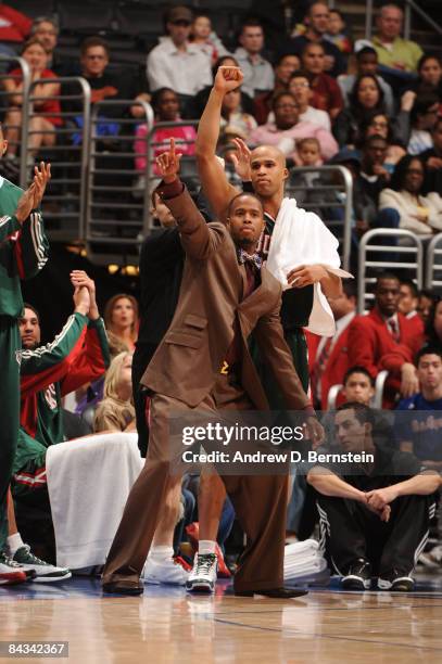 Damon Jones and Richard Jefferson of the Milwaukee Bucks react from the bench during their game against the Los Angeles Clippers at Staples Center on...