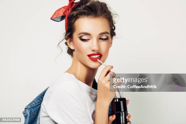 beautiful woman drinking soda - cola stock pictures, royalty-free photos & images