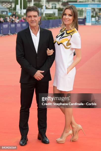 Antonio Banderas and his companion Nicole Kimpel arrive for the screening of "The Music of Silence", during the 43rd Deauville American Film Festival...
