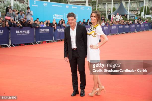 Antonio Banderas and his companion Nicole Kimpel arrive for the screening of "The Music of Silence", during the 43rd Deauville American Film Festival...