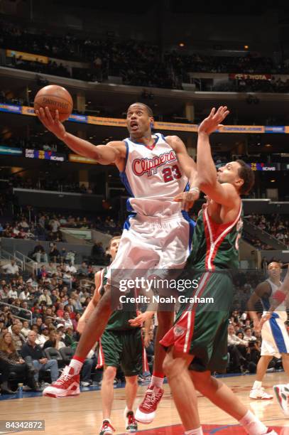 Marcus Camby of the Los Angeles Clippers goes up for a shot against Dan Gadzuric of the Milwaukee Bucks at Staples Center on January 17, 2009 in Los...