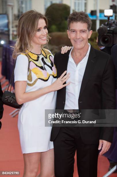 Antonio Banderas and Nicole Kimpel pose on the red carpet before the screening of the movie "The Music Of Silence" during the 43rd Deauville American...