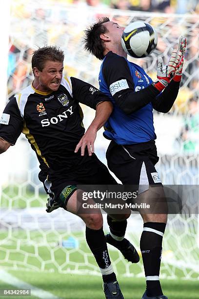 Ben Sigmund of the Phoenix tackles Eugene Galekovic keeper for Adelaide during the round 20 A-League match between the Wellington Phoenix and...