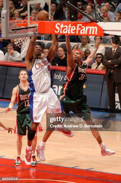 Brian Skinner of the Los Angeles Clippers goes up for a shot against Charlie Villanueva of the Milwaukee Bucks at Staples Center on January 17, 2009...