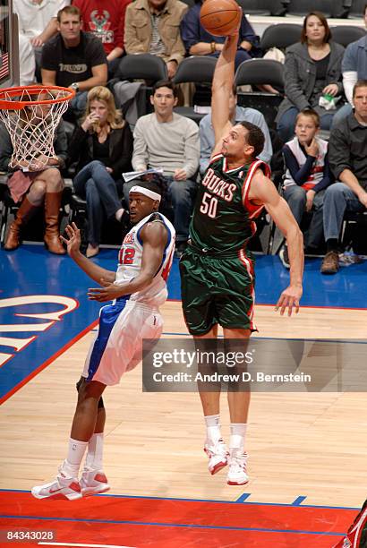 Dan Gadzuric of the Milwaukee Bucks goes up for a dunk against Al Thornton of the Los Angeles Clippers at Staples Center on January 17, 2009 in Los...